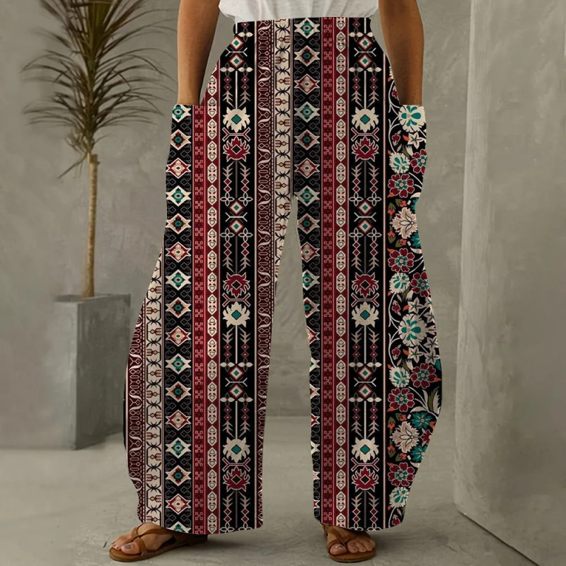 La mode florale a imprimé le pantalon lâche pour l'habillement des femmes Pantalon large de jambe de la poche diagonale des dame